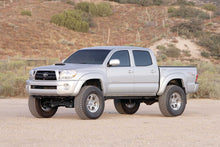 Load image into Gallery viewer, Fabtech 6&quot; BASIC SYS W/PERF SHKS 05-14 TOYOTA TACOMA 4WD/ 2WD 6 LUG MODELS ONLY